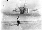 Dan Tate and Wilbur Wright flying 1902 glider.