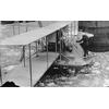 Frank Coffyn standing on hydroaeroplane pontoon with passenger aboard, New York, 1912.