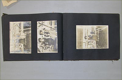 The scrapbook opened to one of the few pages with images still attached.