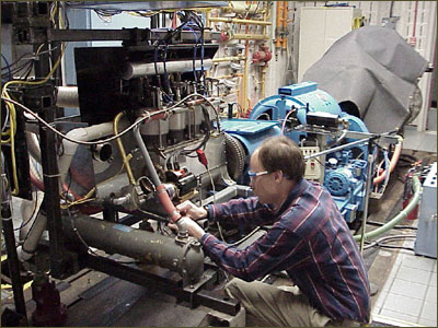 Kevin Kochersberger with the Vertical Four engine during dynamometer tests.