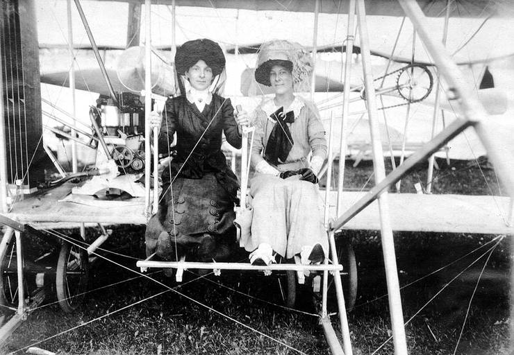 Mrs. Frank Coffyn (left) and an unidentified woman posing in an early Wright Model B at an air meet.