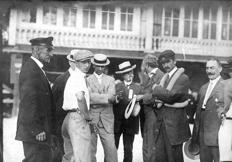 Walter Brookins (3rd from left), Roy Knabenshue(4th from left), and Glenn Curtiss (2nd from right)  with unidentified men at Atlantic City, New Jersey.