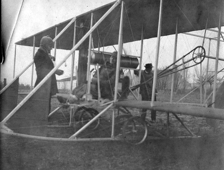 Frank Coffyn preparing for flight in Model B with an unidentified passenger.