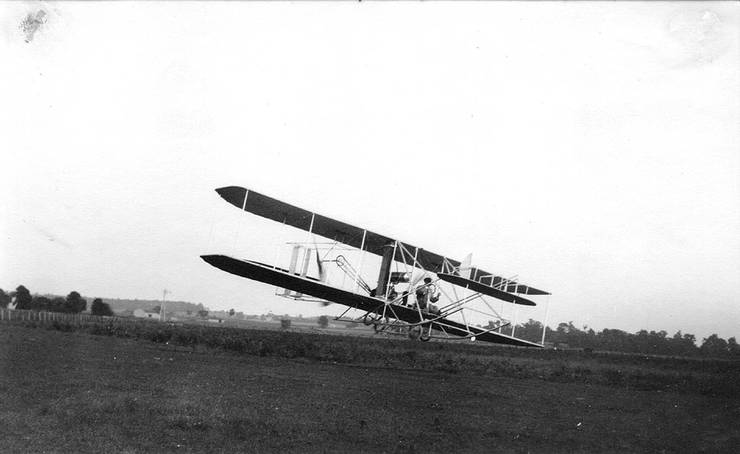 Wright transitional aircraft making a turn. Note top plane of canard has been removed.