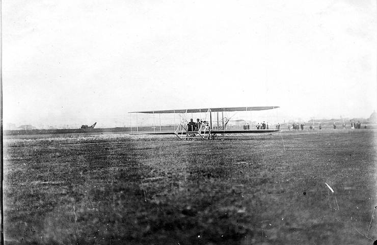 Unidentified Wright aviator with passenger aboard early Wright Model B. Note: Image is printed backwards.
