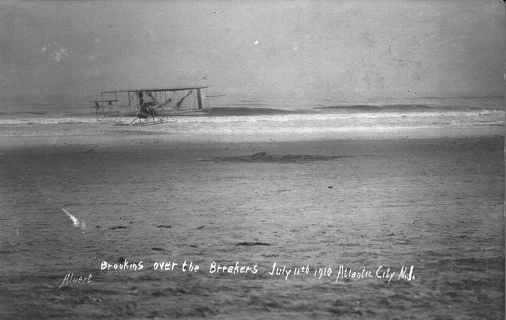 Postcard of Walter Brookins flying over the surf in New Jersey, with Frank Coffyn as passenger.