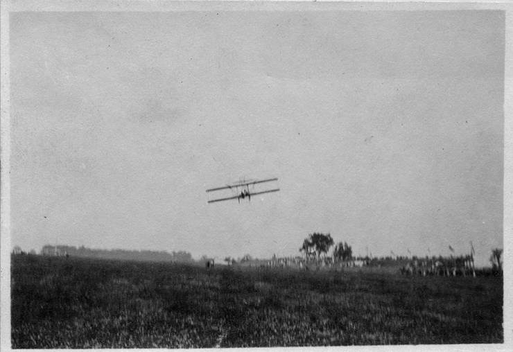Model B flying toward grandstands.