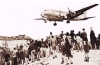 Children watching plane arrive