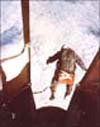 Captain Kittinger steps from a balloon-supported gondola at 102,800 feet in his high-altitude jump from the Excelsior
