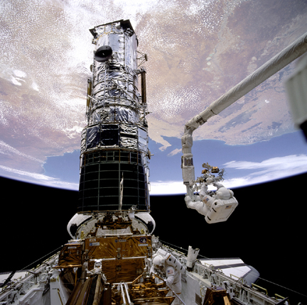 Astronaut Musgrave on Remote Manipulator System arm