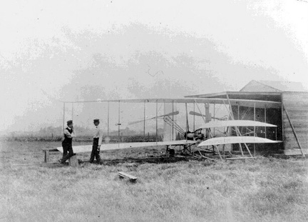 Wilbur and Orville consult over the Flyer 2.