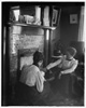  Katharine Wright and Harriet Silliman, seated near the fireplace. 
